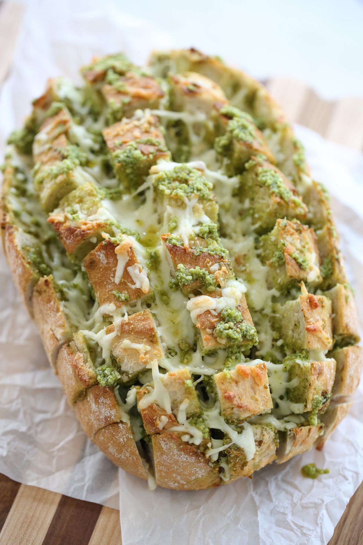 Loaf of bread with cheese and pesto