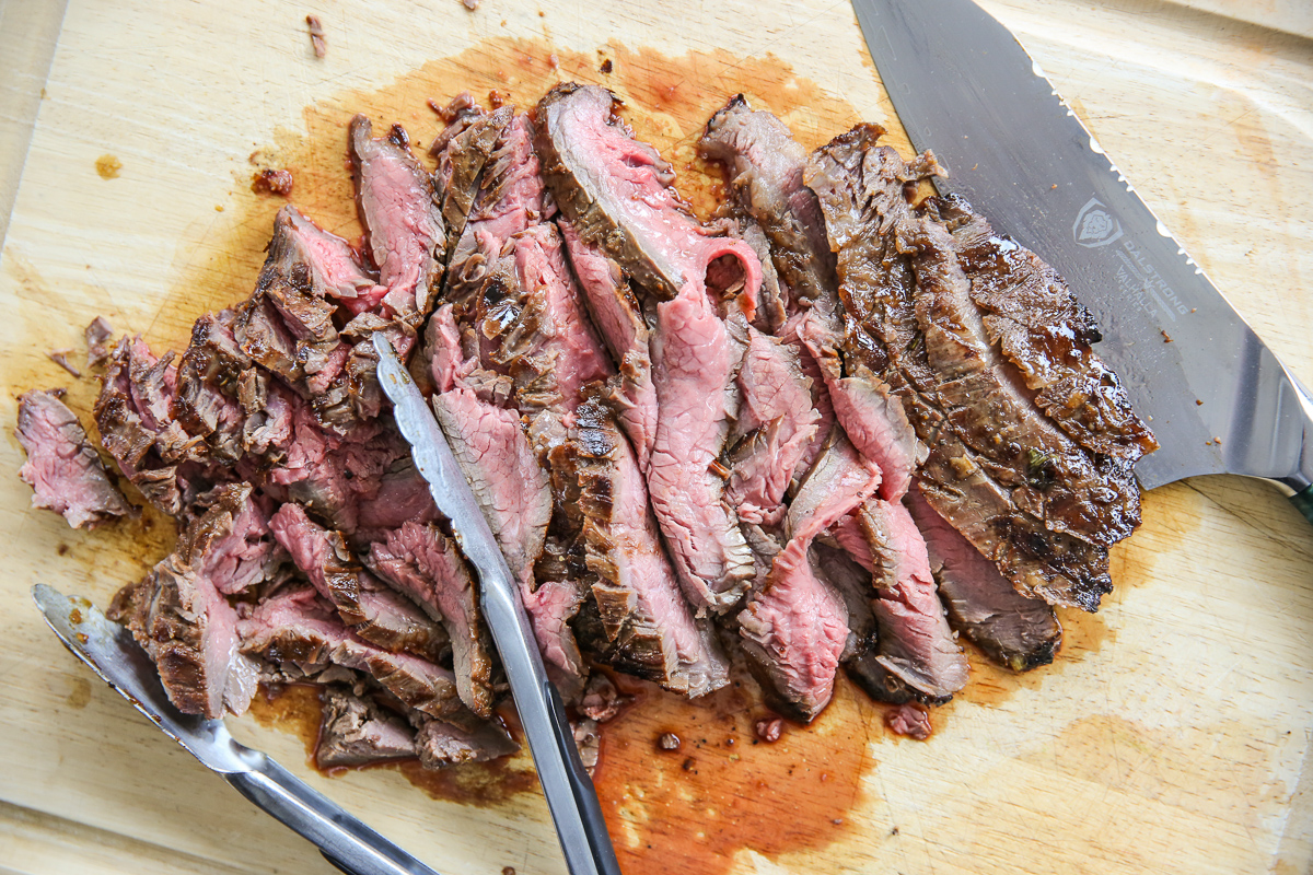 Sliced Ginger Soy Flank Steak on a cutting board
