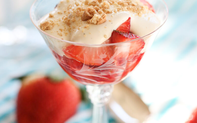 strawberries with cream and cookies on top