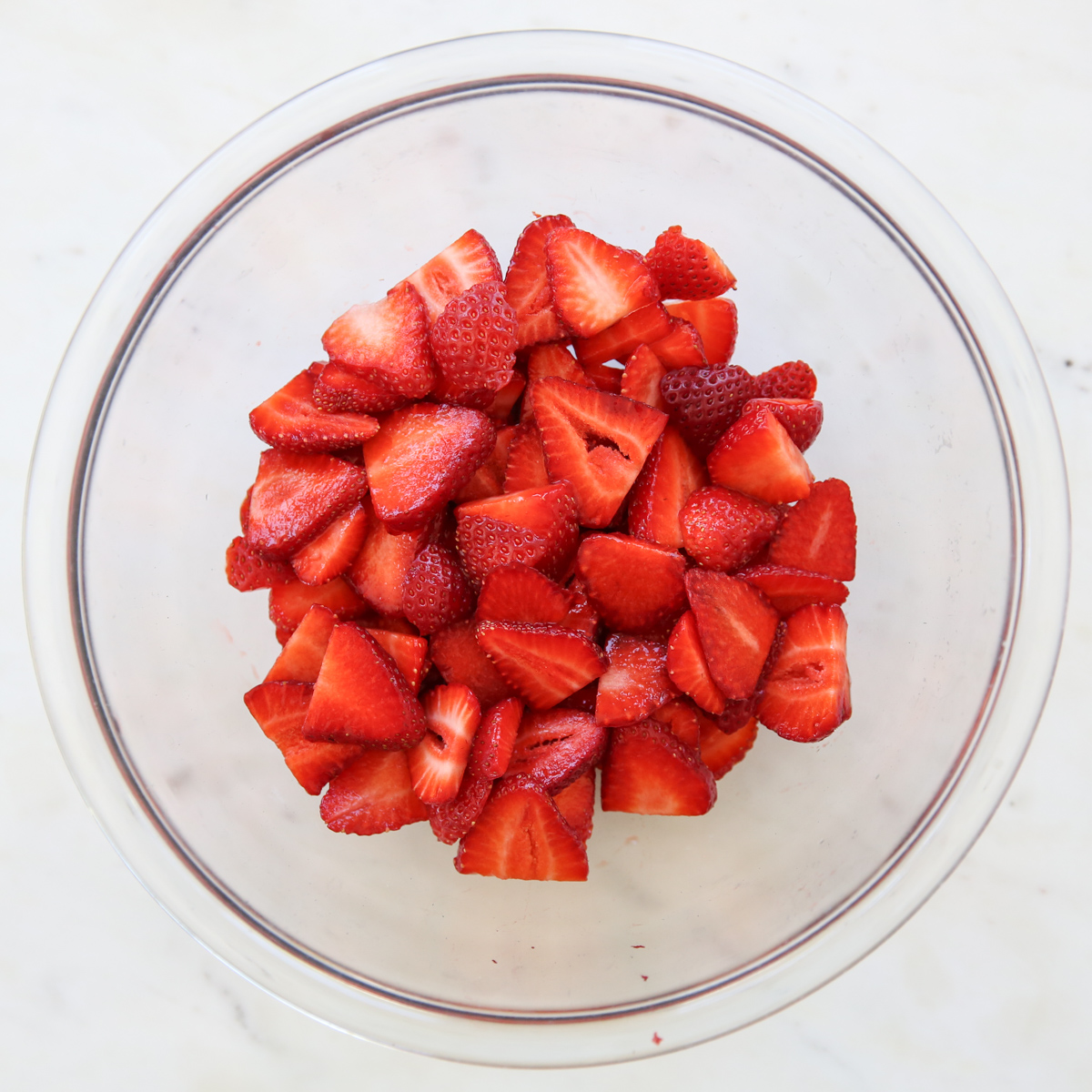 sliced strawberries in a bowl