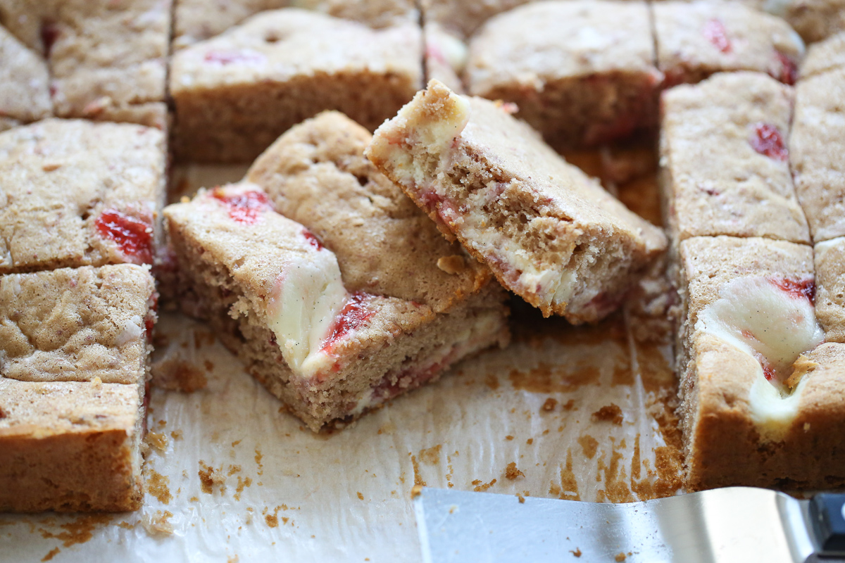 sliced strawberry cheesecake swirled cake