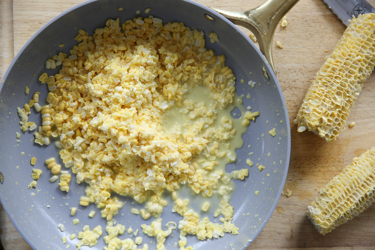 chopped corn and corn pulp in a saute pan