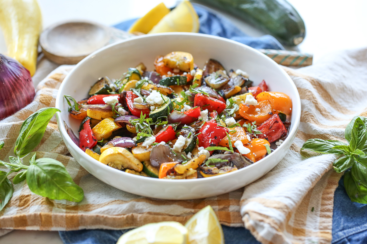 Bowl of colorful grilled vegetables in a grill basket