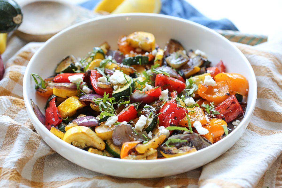 Bowl of colorful grilled vegetables in a grill basket